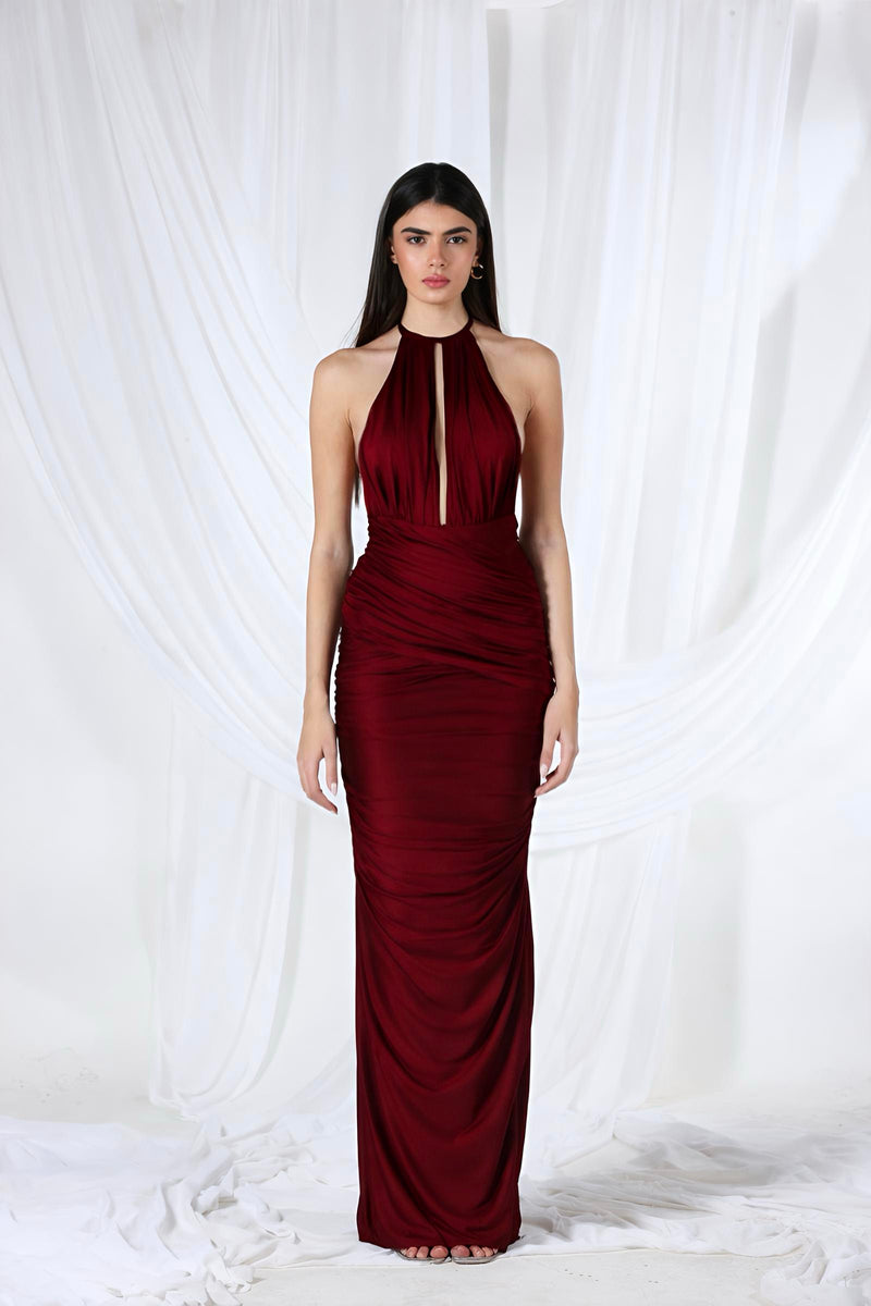 Aquarel Studio burgundy Stella maxi dress with flowing fabric, V-neckline, and long sleeves, displayed on a hanger.