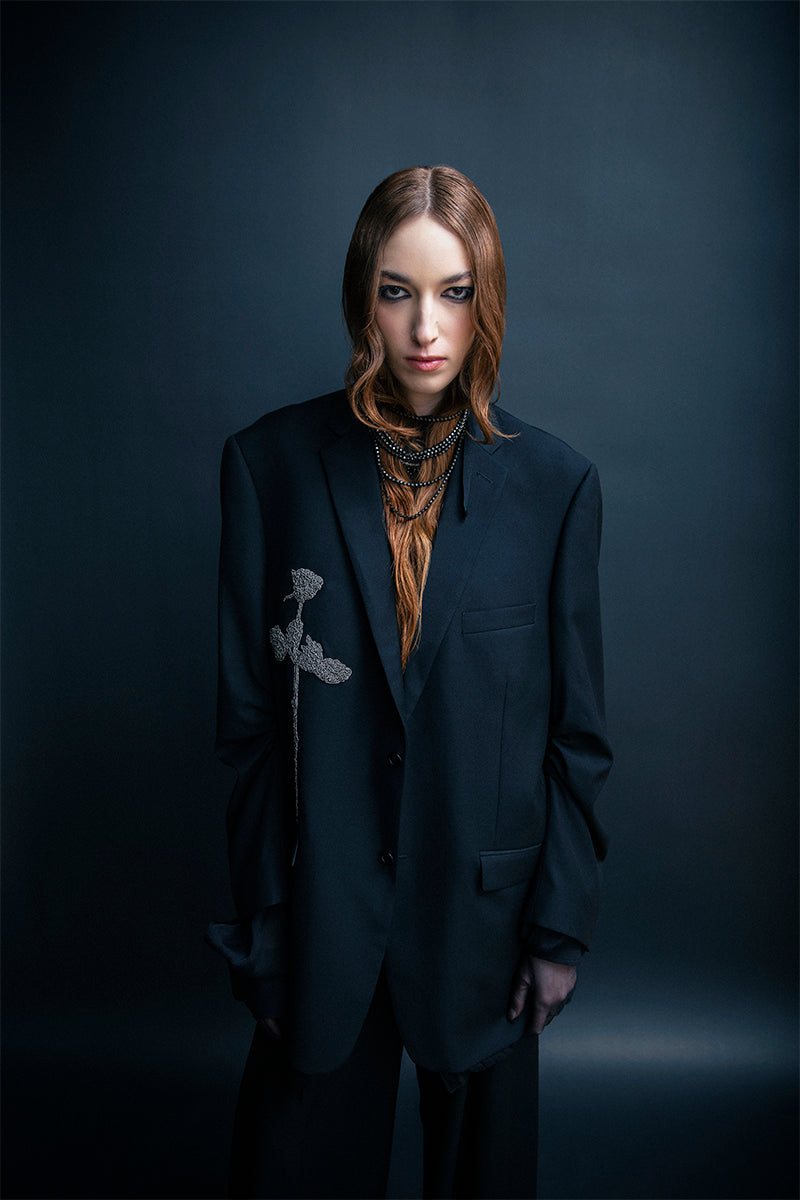 Black oversized blazer by Vaska with intricate beaded embroidery, stylish jacket perfect for modern fashion statements.