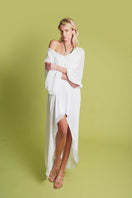 White PAZ maxi dress by Laura Escobar, flowing fabric with elegant design, perfect for summer or special occasions.