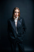 Black distressed Vaska jacket with a rugged, worn-in look, featuring frayed edges and a casual fit.
