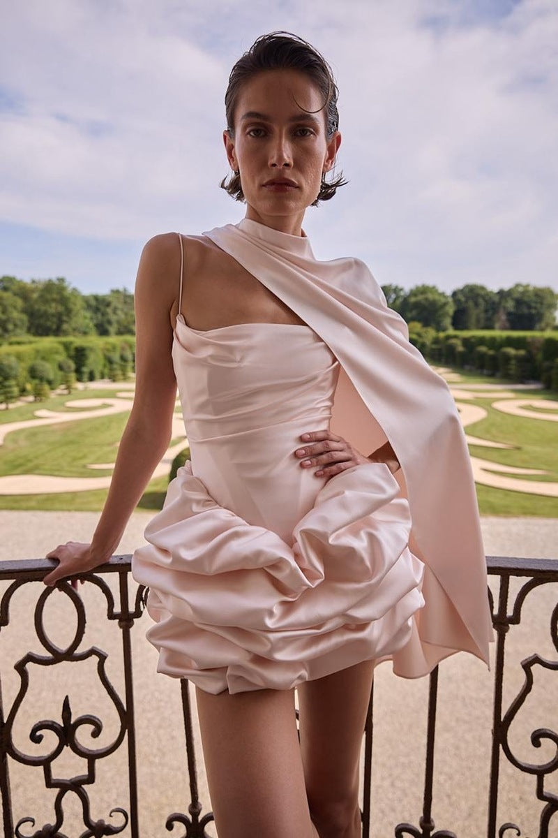 Blush pink SARIS mini dress by BALYKINA, featuring a stylish and elegant design, shown on a model.