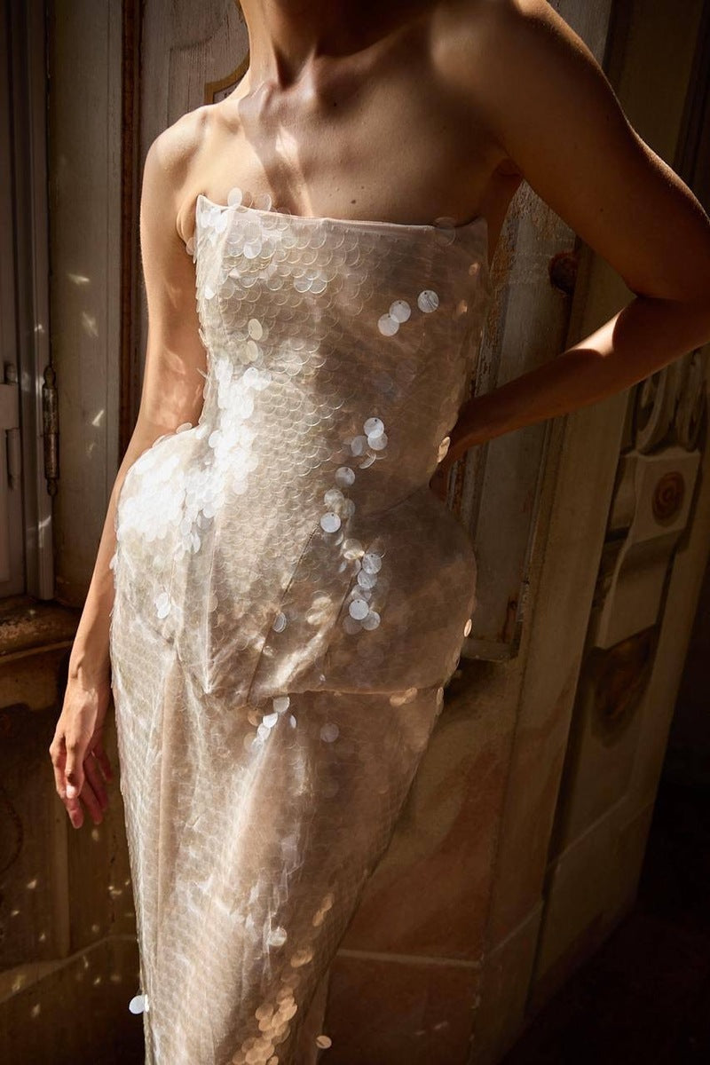 Elegant black MUNA gown by BALYKINA with intricate lace detailing and flowing fabric, perfect for formal occasions.