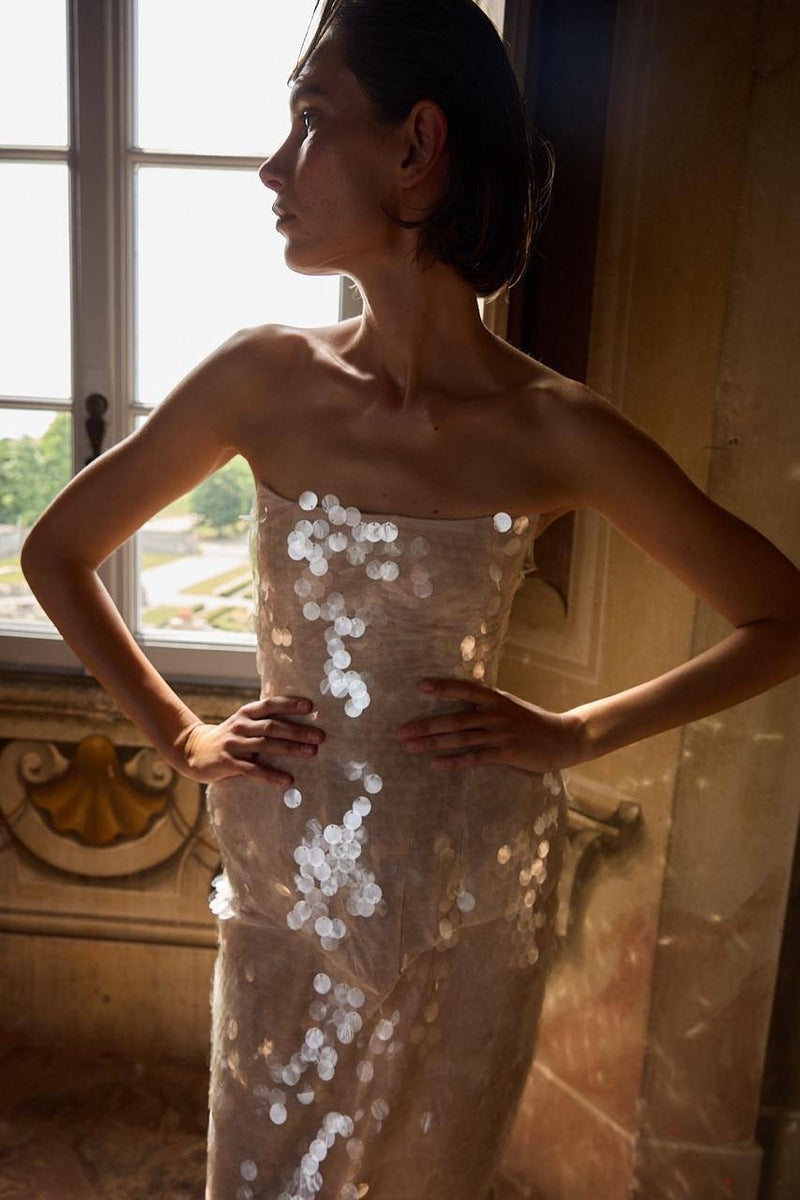 Elegant BALYKINA MUNA gown with flowing fabric and intricate detailing, perfect for formal occasions.