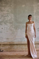 Blush pink Fiori gown by Balykina, elegant formal dress with flowing fabric and intricate design, perfect for special occasions.