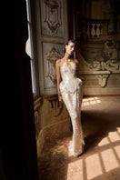 Elegant BALYKINA MUNA gown with intricate detailing and flowing fabric, perfect for formal occasions.