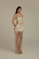 Cream white Seraphina maxi dress by POEM, flowing fabric with elegant design, displayed on a hanger.