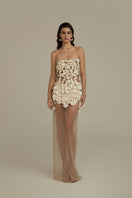 Cream white Seraphina maxi dress by POEM, flowing fabric and elegant design, displayed on a hanger against a neutral background.