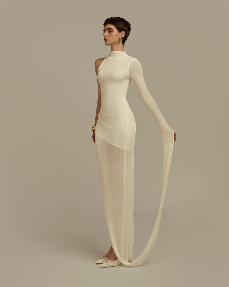White POEM HYPERION maxi dress with flowing fabric and elegant design, perfect for summer or special occasions.
