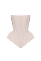 Blush pink EVA corset top by BALYKINA featuring a fitted design and adjustable straps, styled for a modern, trendy look.