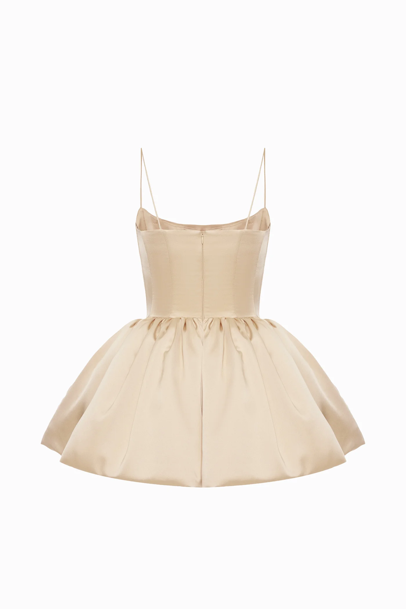 Beige Balykina Saris mini dress displayed on a hanger, showcasing its stylish design and fabric details.