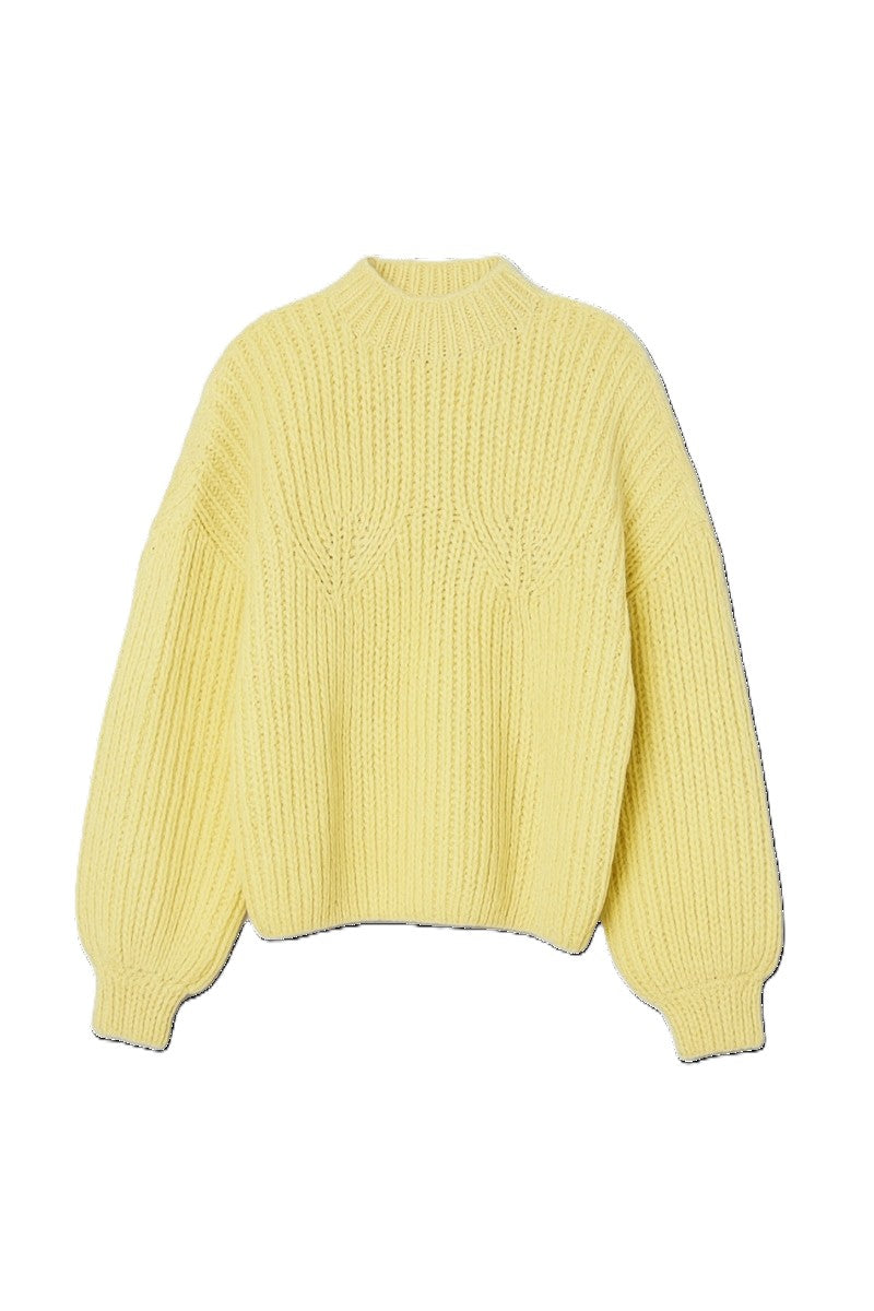 First Born Knits shell sweater featuring a cozy, textured design in soft, neutral colors.