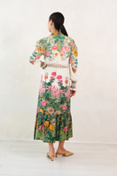 Raishma Carey midi dress with elegant floral pattern and fitted waist, displayed on a mannequin.