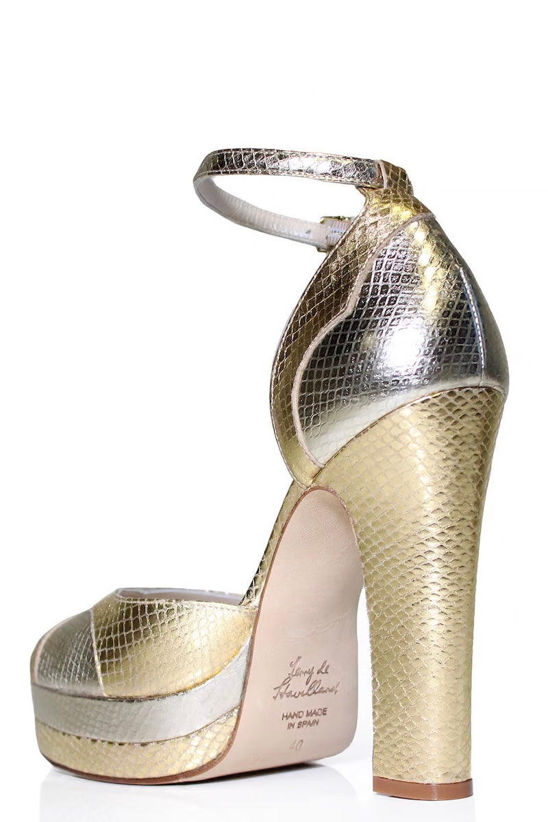 Gold Lily platform block heel shoes by Terry de Havilland, featuring a stylish heel design and a sleek gold finish.
