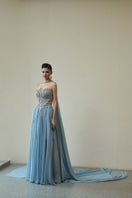 Blue Venus gown by HACCHIC COUTURE showcasing elegant fabric and intricate design details.