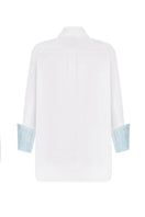 Nué mirror shirt featuring a stylish design, shown in a close-up image highlighting the fabric and pattern details.