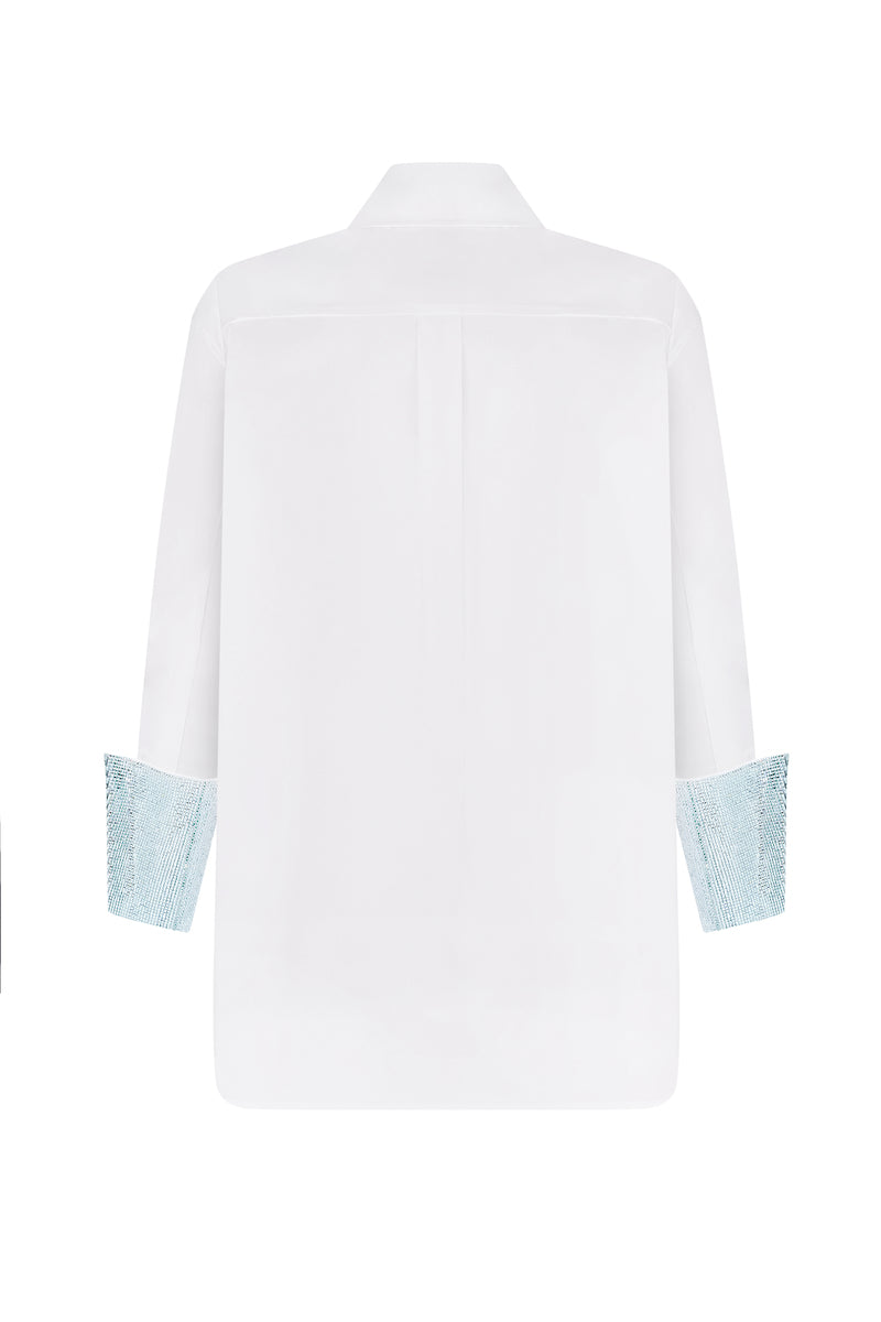 Nué mirror shirt featuring a stylish design, shown in a close-up image highlighting the fabric and pattern details.