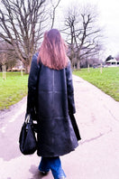 Black Zina biker shearling coat by Verheyen, featuring a stylish biker design with a plush shearling collar and sleek silhouette.