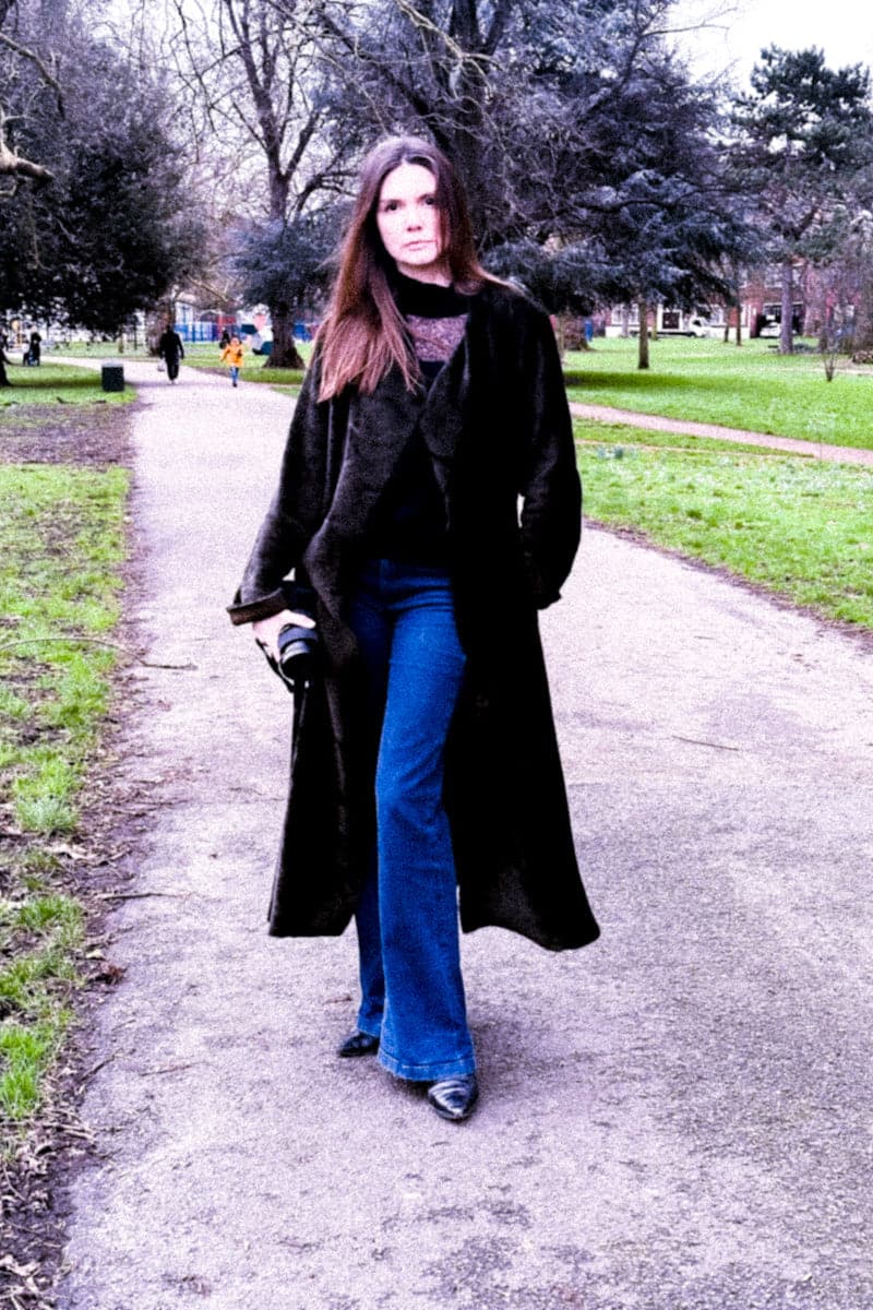 Verheyen Zina biker shearling black coat displayed on a hanger, featuring a classic biker style with shearling lining.