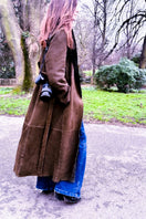 Verheyen Bella reversible shearling coat with plush shearling lining and stylish outer fabric, displayed on a hanger.