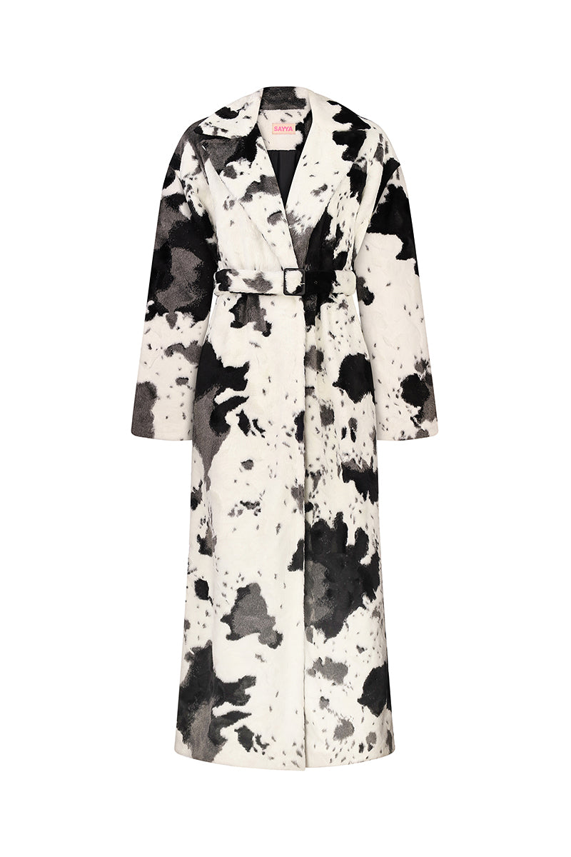 Sayya fur maxi coat in cow print, stylish long coat with plush fur texture and bold black and white pattern.