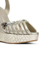 Terry de Havilland Margaux Gold Heels showcasing elegant gold-toned leather with pointed toes and stylish stiletto heels.