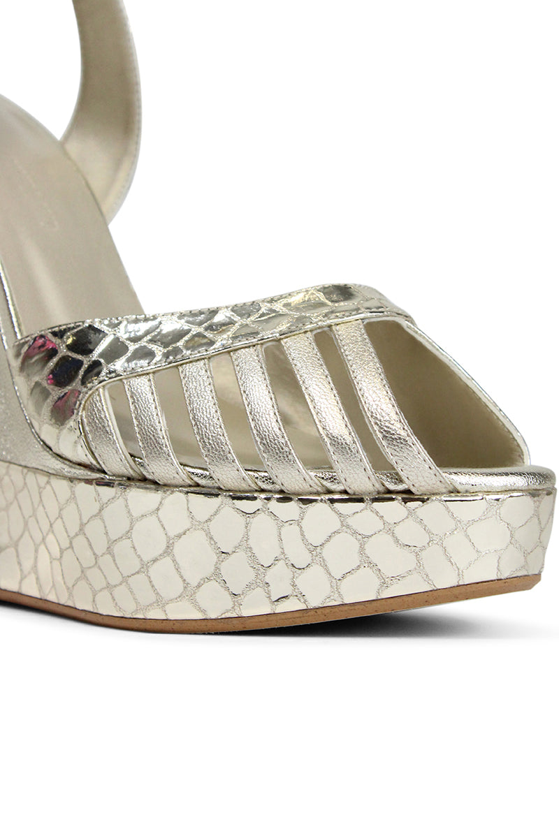 Terry de Havilland Margaux Gold Heels showcasing elegant gold-toned leather with pointed toes and stylish stiletto heels.