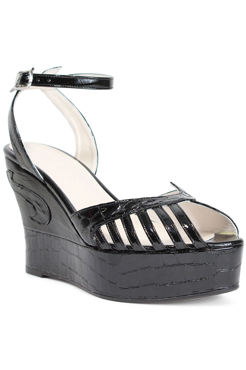 Black Margaux mid heels by Terry de Havilland, stylish footwear with a sleek design and pointed toe, displayed on a plain background.