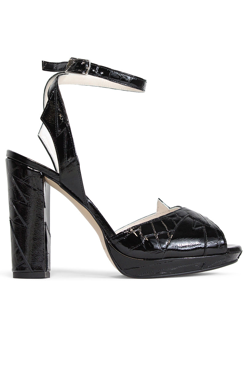 Black Terry de Havilland Zia mid heels with sleek design and pointed toes, shown on a neutral background.