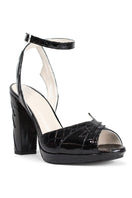 Black ZIA mid heels by Terry de Havilland, stylish open-toe shoes with a sleek design and sturdy heel for elegant wear.