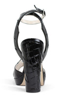 Black ZIA mid heels by Terry de Havilland with sleek design and pointed toes, shown on a white background.