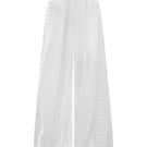 Nué Solange white pants displayed on a model, showcasing a stylish and comfortable fit in a casual fashion style.