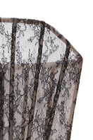 Nué Allure Corset Top displayed on a hanger, showcasing its fitted design and stylish details in a close-up image.