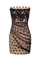 Nué Bettina mini dress displayed on a hanger, featuring a stylish, lightweight fabric with a fitted silhouette and subtle design details.