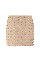 Nué Chantal mini skirt, stylish short skirt with a fitted design, shown in a flattering pose on a model.