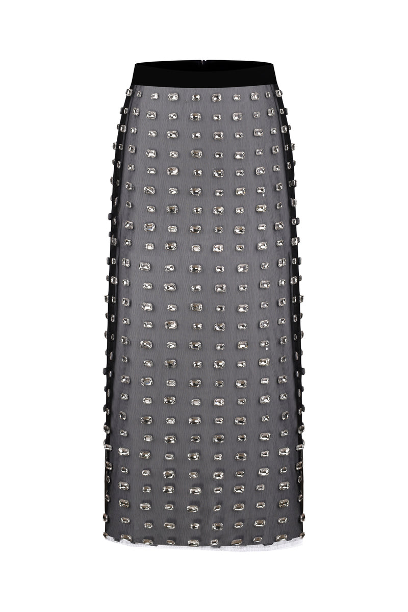 Black Nué Chantal midi skirt displayed on a model, showcasing its elegant, flowing design and versatile length.