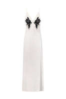 White Nué Perla Maxi Dress with flowing fabric and elegant design, perfect for summer or special occasions.