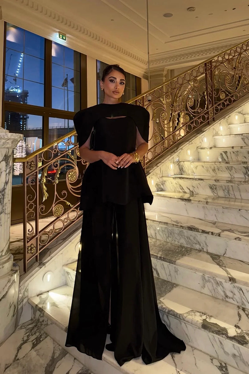 Elegant black gown by MATTERS, Verona style, featuring a flowing silhouette and stylish design perfect for formal occasions.