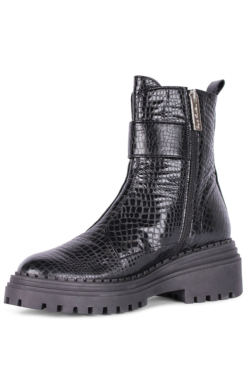 Black Festival boots by Terry de Havilland with pointed toes and chunky heels, displayed on a neutral background.