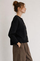 First Born Knits Frenchie Ete cardigan in soft knit with a relaxed fit, displayed on a neutral background.