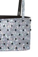 Nué Charlotte Polka-Dot Crystal Top displayed on a hanger, featuring a stylish polka-dot pattern and crystal accents.