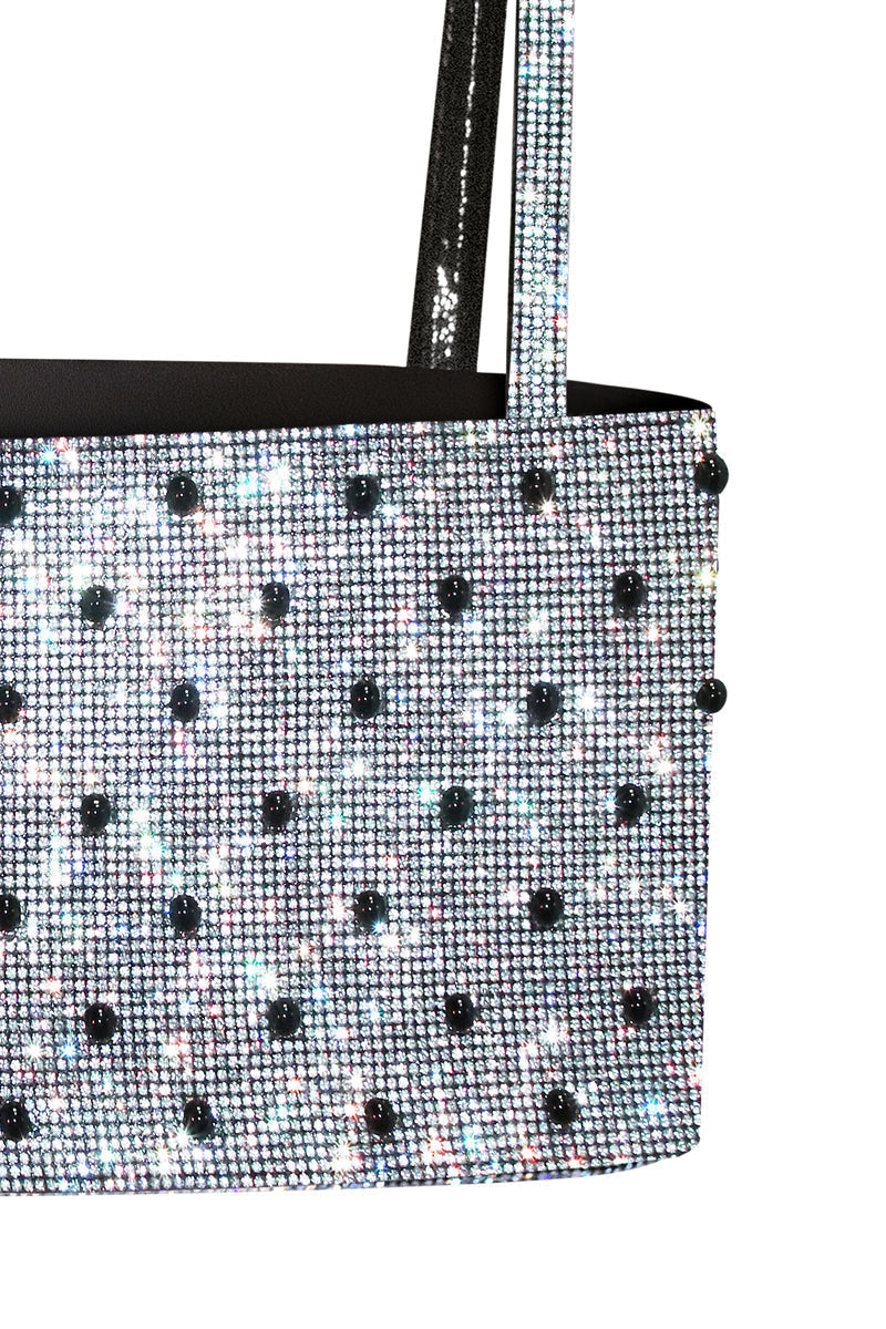 Nué Charlotte Polka-Dot Crystal Top displayed on a hanger, featuring a stylish polka-dot pattern and crystal accents.