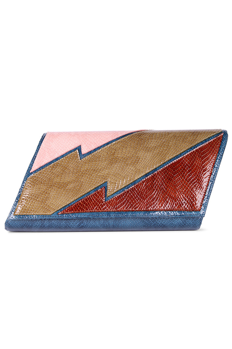 Terry de Havilland clutch bag inspired by 70s New York style, featuring a sleek design and vintage-inspired details.