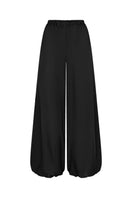Nué Solange black pants shown, featuring a stylish fit and smooth fabric, perfect for casual or dressy occasions.