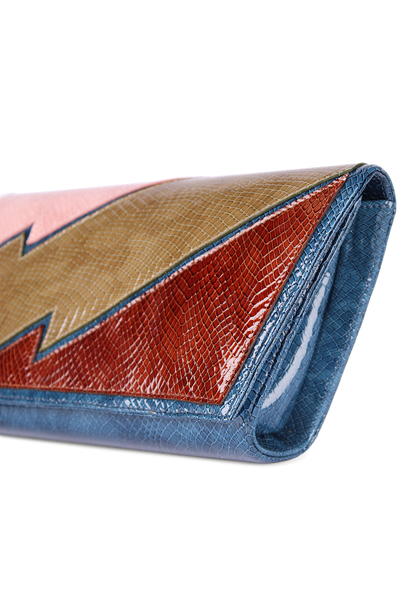 Terry de Havilland clutch bag in New York 70s style with textured leather and vintage design, displayed on a neutral background.