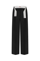 Nué Martine pants in black, stylish women's pants shown on a model, featuring a tailored fit and classic design.
