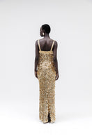 Studio NK Imperial gold gown featuring elegant fabric and intricate design, perfect for formal occasions.
