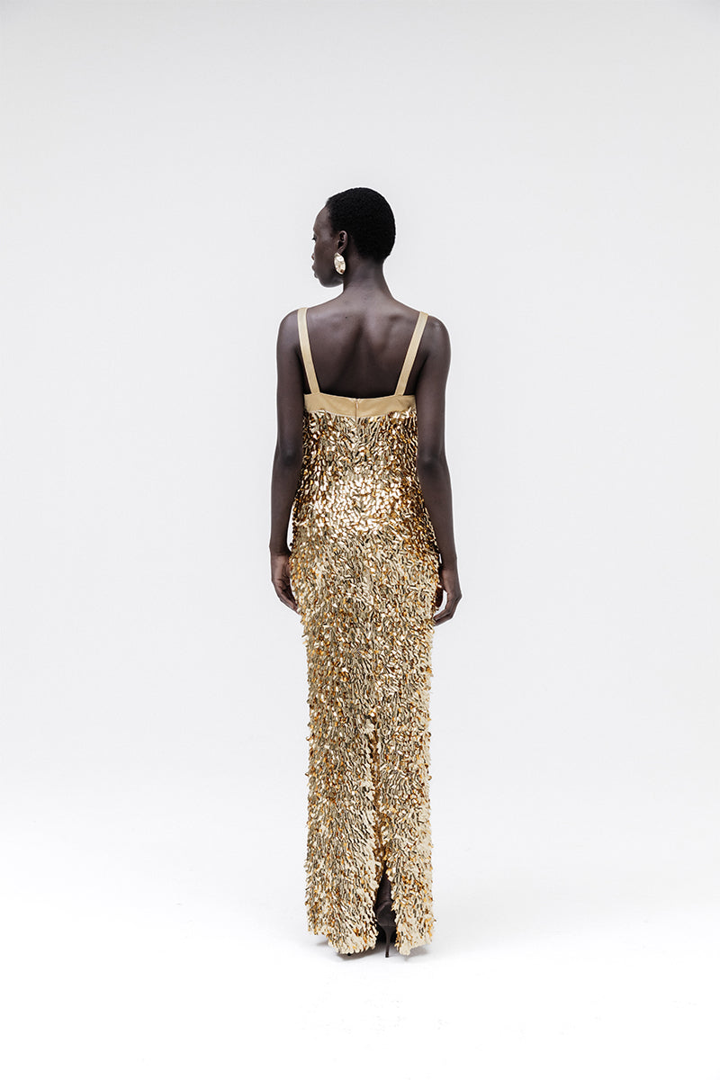 Studio NK Imperial gold gown featuring elegant fabric and intricate design, perfect for formal occasions.