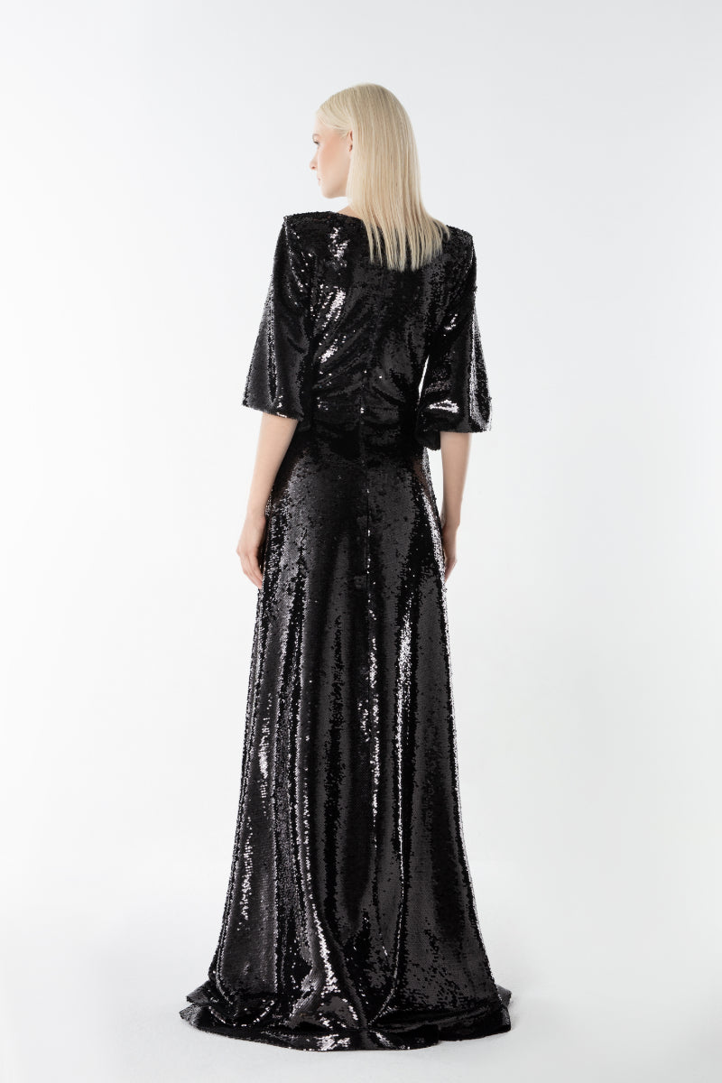 Lili Blanc Glow Gown in soft fabric, featuring elegant design and flowing silhouette, perfect for formal occasions.
