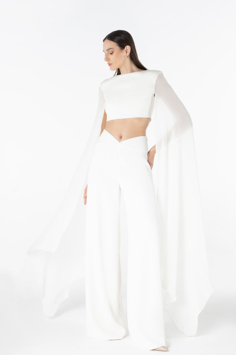 Lili Blanc sculpted cropped top in vibrant fabric, featuring a fitted design and stylish neckline, perfect for fashion-forward outfits.