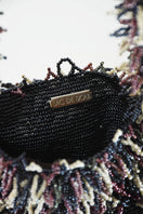 Inside view of SAC DE SOUL Nina top handle bag in gunpowder black, garnet, and cream with interior compartments.